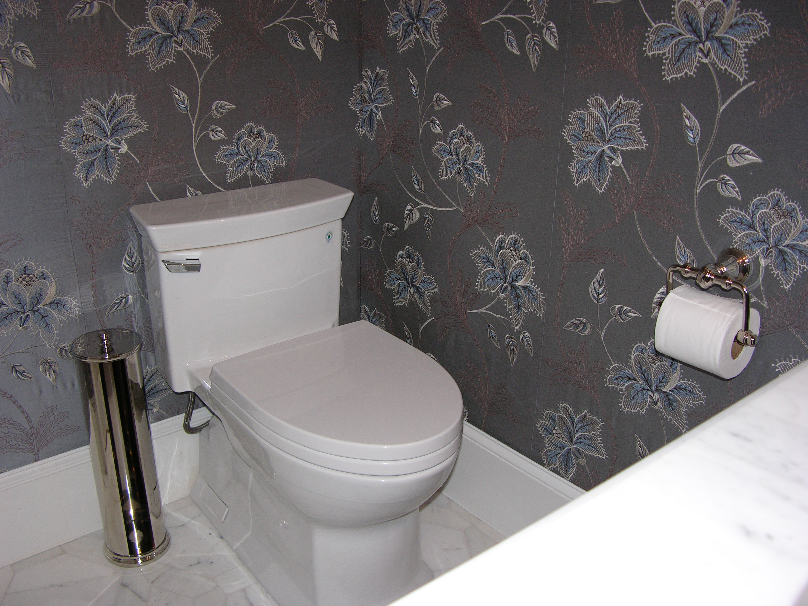 powder room with fabric on the walls