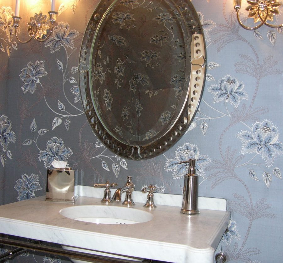 marble vanity in front of fabric walls