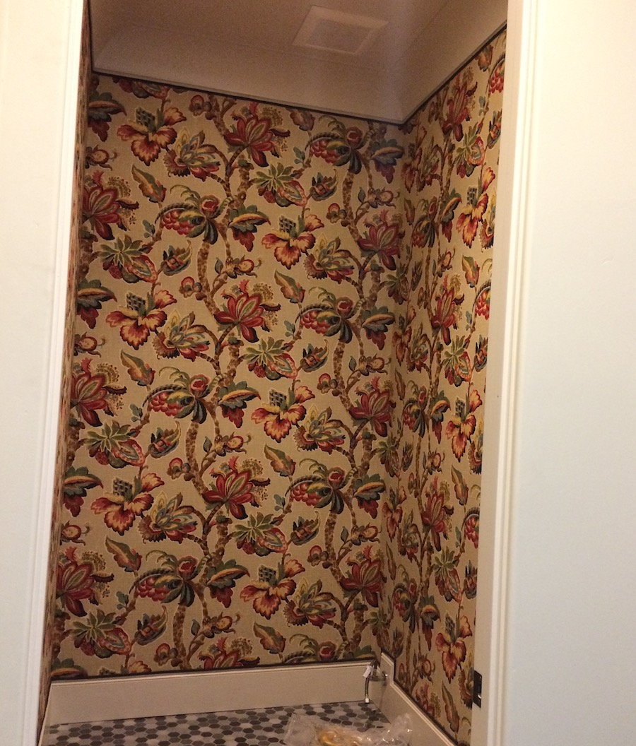 fabric on walls in a small room