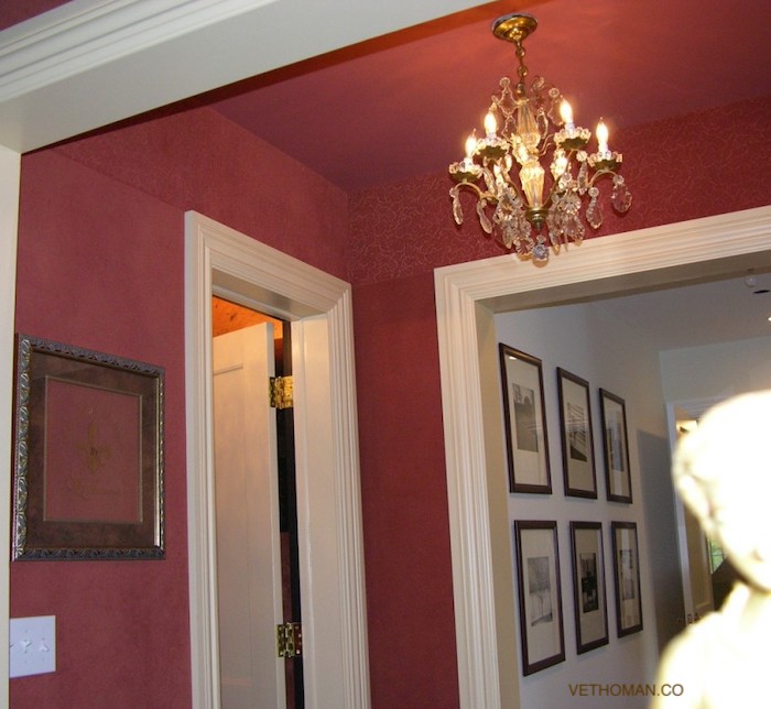 small hallway in red fabric on walls