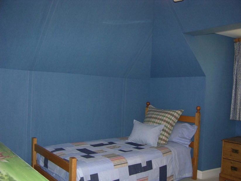 Wall upholstery in a bedroom _ Denim fabric