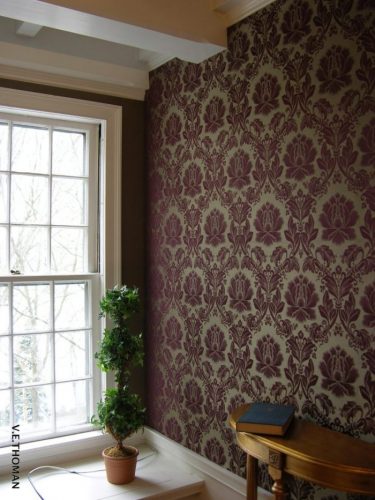 damask fabric installed on the wall in a reading room