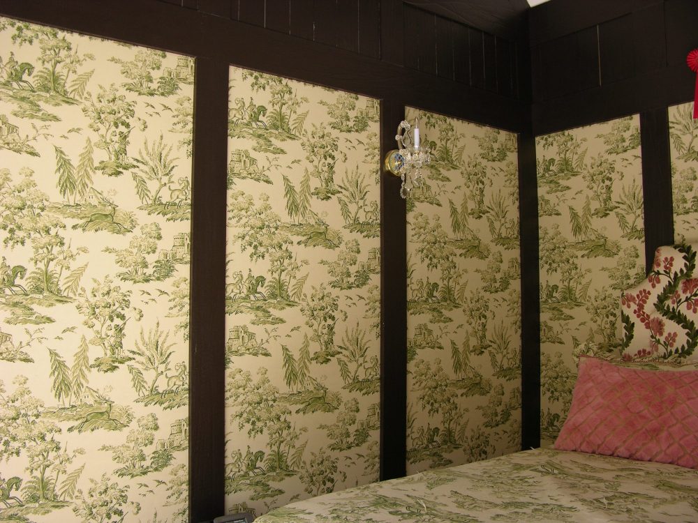 printed green fabric in wall panels