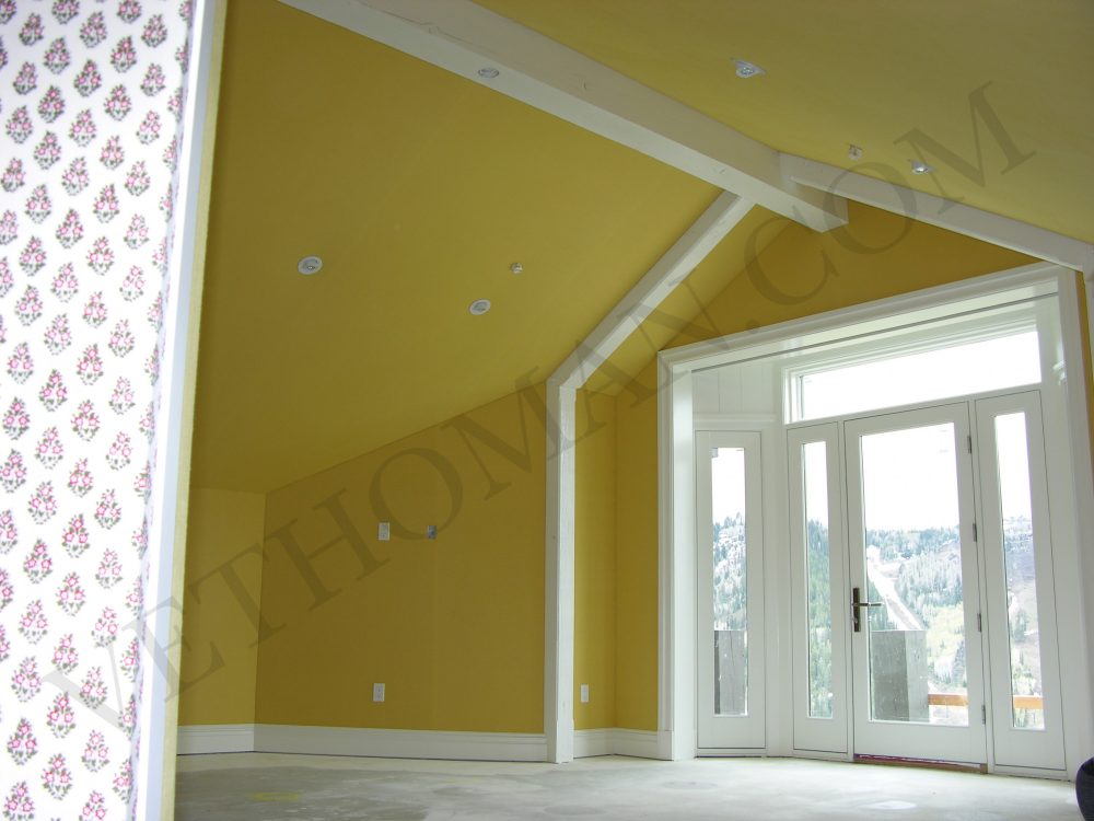 yellow fabric on walls in bedroom
