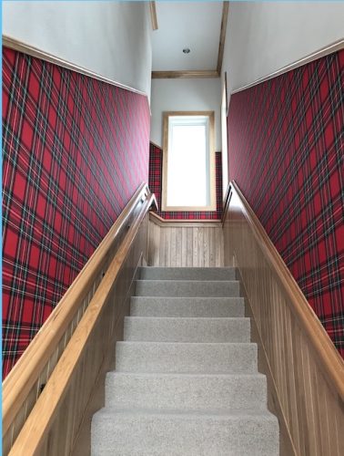 plaid upholstery fabric on walls in staircase