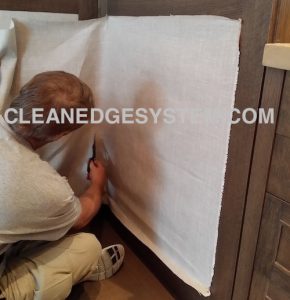 CUT THE EXCESS FABRIC ON WALL PANEL