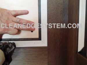 stapling clean edge system track to the wall