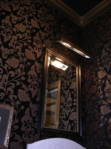 powder room walls upholstered in fabrics