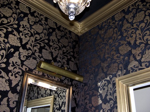 powder room walls upholstered in fabric